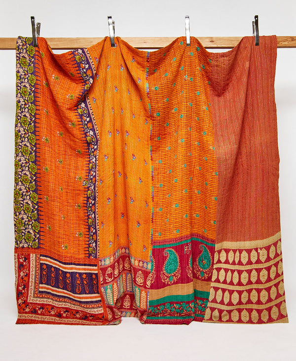 King kantha quilt in orange paisley pattern handmade in India
