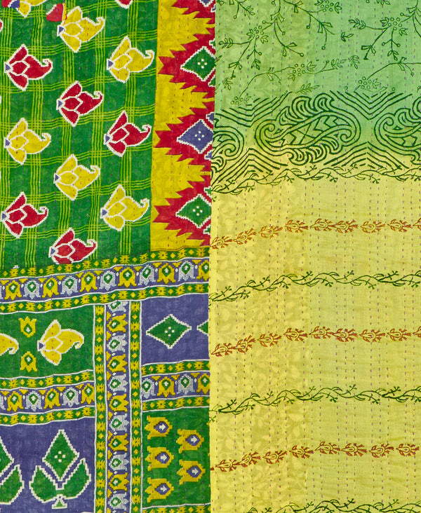 a green abstract  kantha bedding quilt ethically made from vintage cotton fabric
