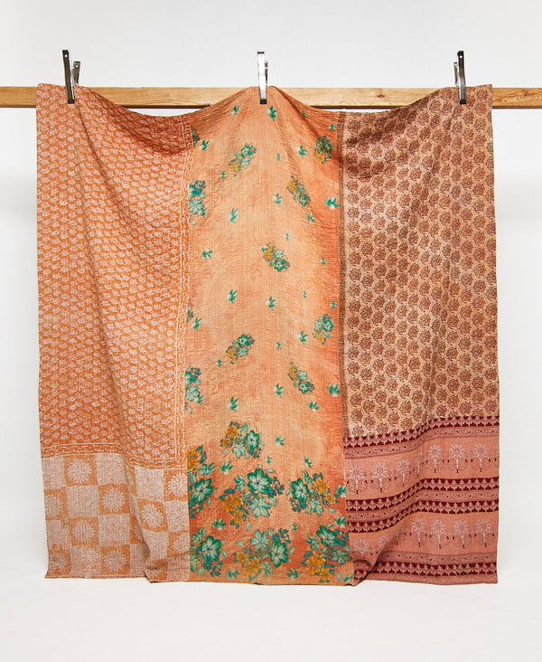 Queen kantha quilt in an orange floral pattern handmade in India
