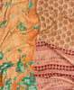 Queen kantha quilt with reversible orange floral pattern
