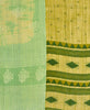 A green geometric kantha bedding quilt ethically made from vintage cotton fabric
