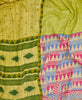 Queen kantha quilt with reversible green geometric pattern

