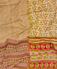 Queen kantha quilt with reversible beige and red traditional pattern

