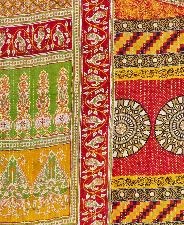 Twin kantha quilt with reversible orange pattern