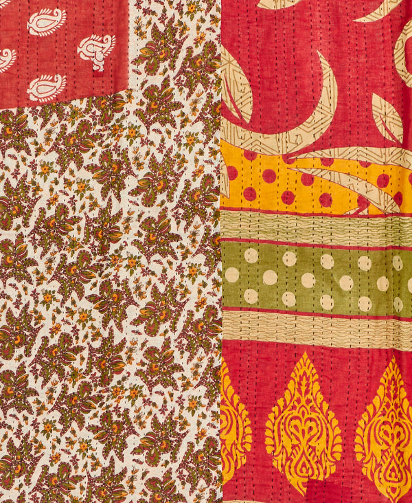 Twin kantha quilt with reversible red geometric pattern