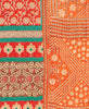 Twin kantha quilt with reversible orange floral pattern