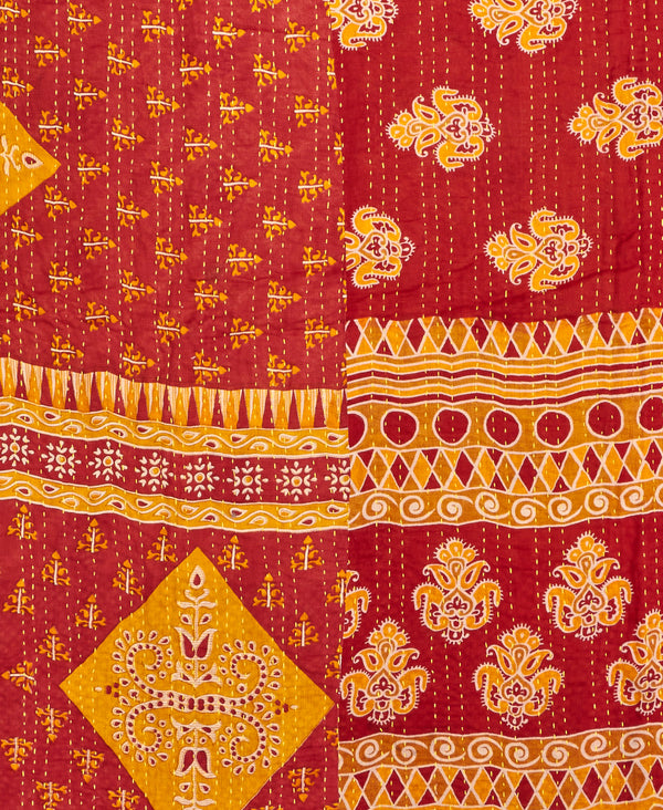 Twin kantha quilt with reversible red and yellow geometric pattern