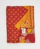 Artisan-made twin kantha quilt in a red and yellow geometric design made from upcycled saris
