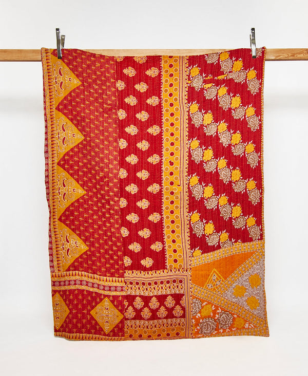Twin kantha quilt in a red and yellow geometric pattern handmade in India
