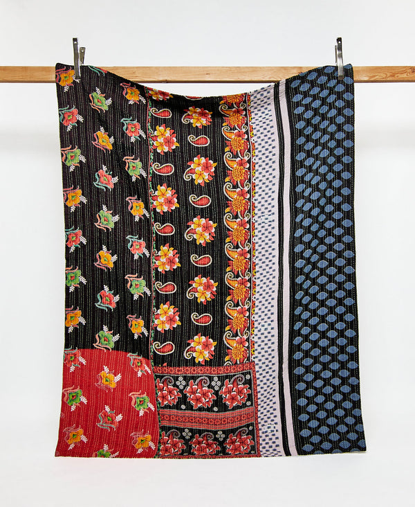 Twin kantha quilt in a contrasting floral and paisley pattern handmade in India
