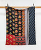 Twin kantha quilt in a contrasting floral and paisley pattern handmade in India
