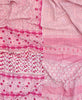 Twin kantha quilt with reversible pink floral pattern