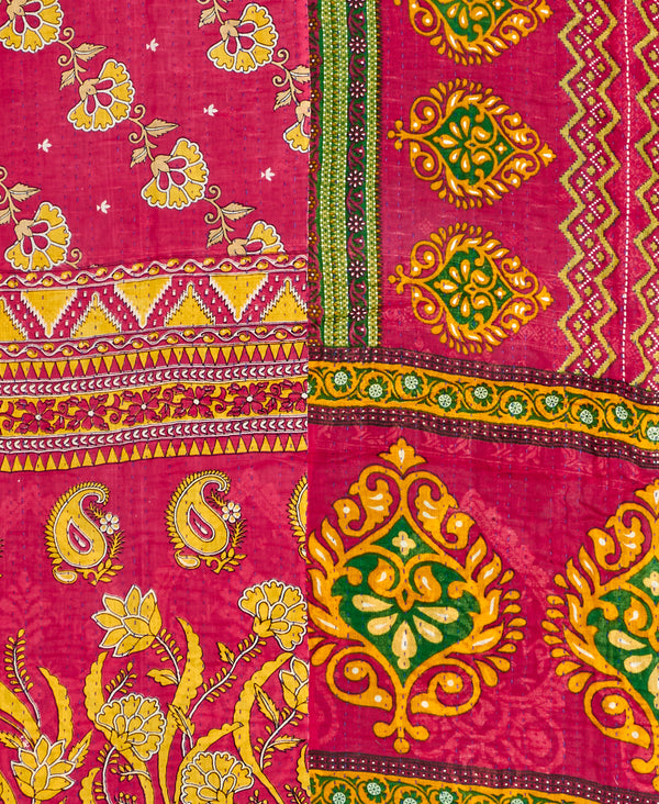 Twin kantha quilt with reversible red and yellow paisley pattern