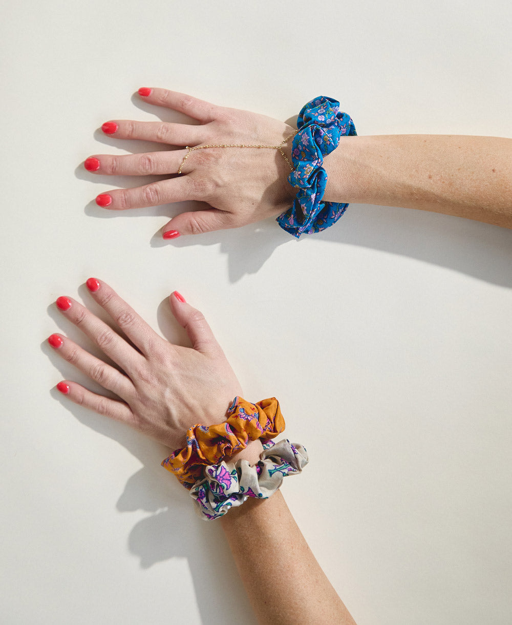 colorful vintage silk scrunchies on woman's wrist