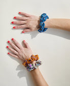 colorful vintage silk scrunchies on woman's wrist