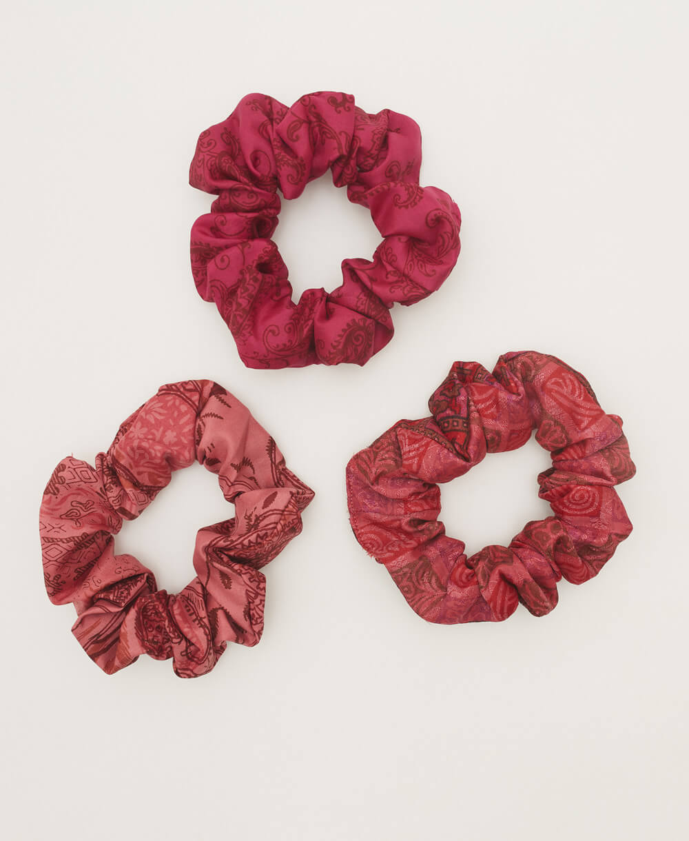 pink and red silk scrunchies handmade in India from upcycled vintage silk sari scrap fabrics
