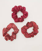 pink and red silk scrunchies handmade in India from upcycled vintage silk sari scrap fabrics