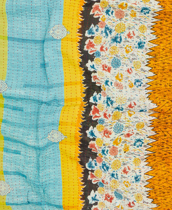 Blue, yellow, and black contrasting pattern small quilt throw featuring red traditional kantha hand stitching 