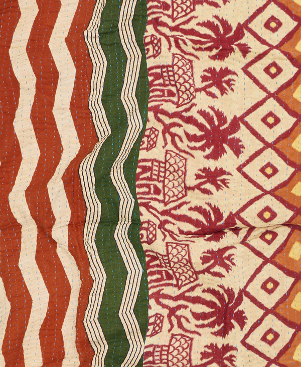 Contrasting muted green, orange, and burgundy stripe and palm tree print make this a unique one-of-a-kind piece 