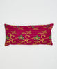 red cotton lumbar pillow with green flowers and orange and yellow vines