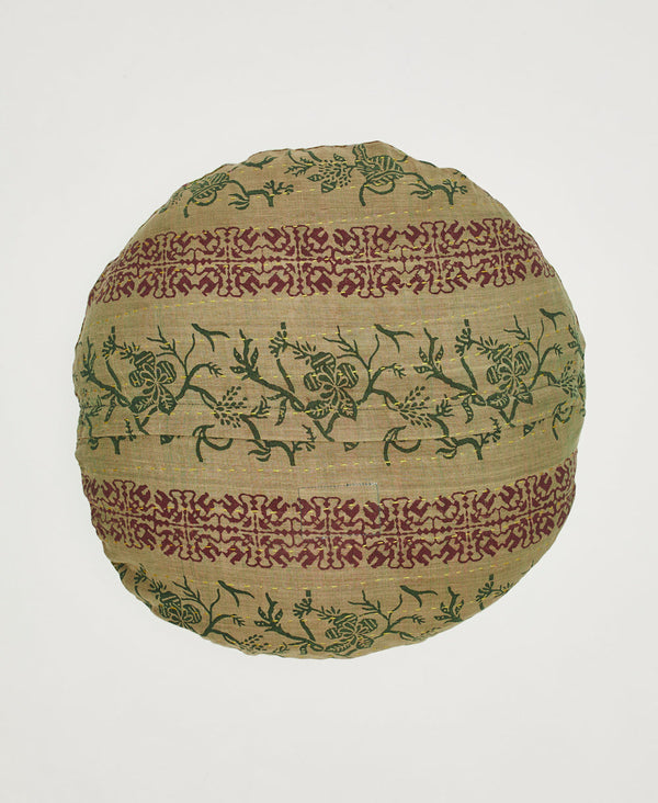 Tan, green, and red round throw pillow featuring yellow traditional kantha hand stitching 