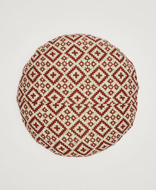 White and red throw pillow featuring black traditional kantha hand stitching 
