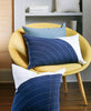 modern navy lumbar organic pillow in yellow mid-century chair