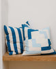 two cabana striped blue and white throw pillows in entryway bench by Anchal Project