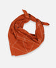 Anchal Project organic cotton bandana scarf with hand-stitched geometric pattern in rust orange