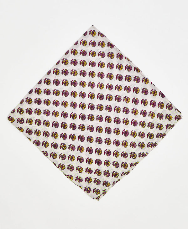 white vintage kantha bandana with purple, pink, and yellow, flowers repeating across the fabric and neon yellow traditional kantha stitching 