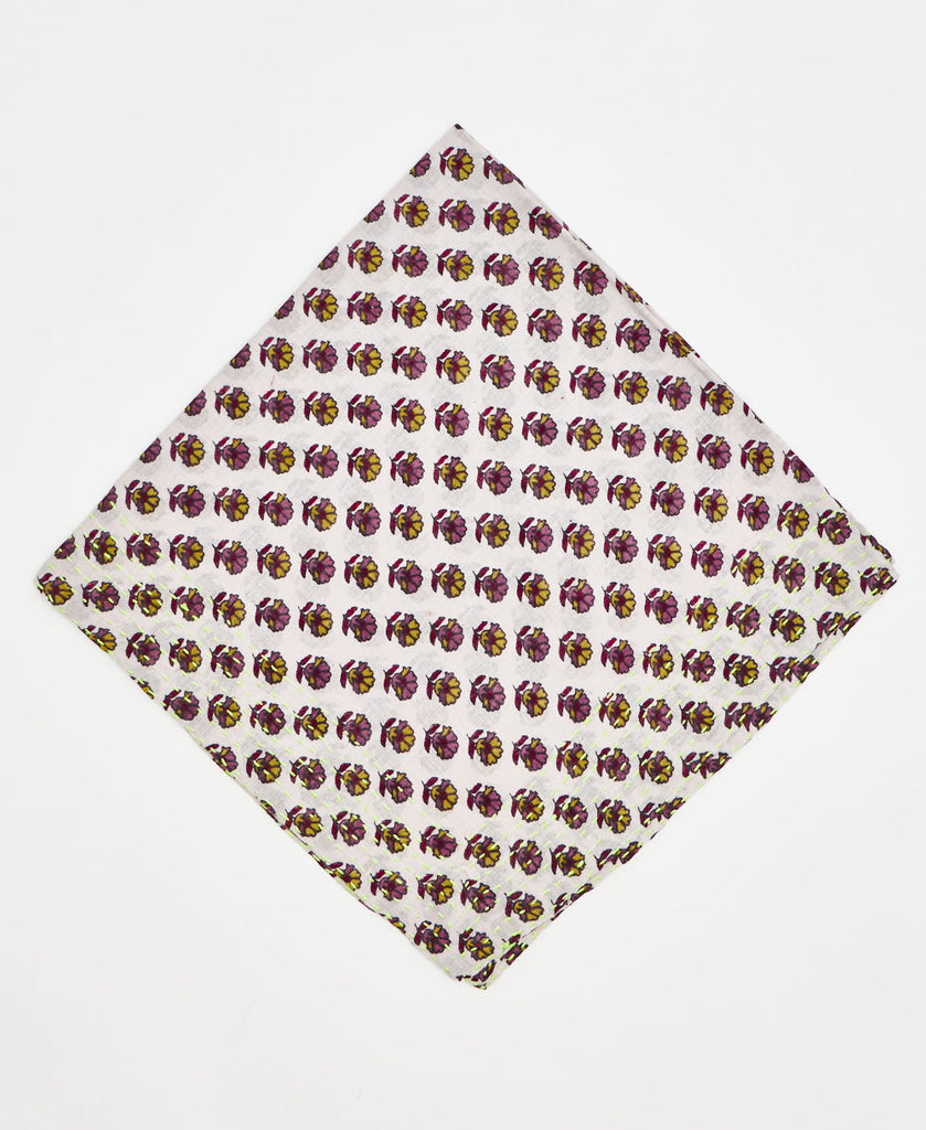 white vintage kantha bandana with purple, pink, and yellow, flowers repeating across the fabric and neon yellow traditional kantha stitching 