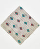 beige cotton bandana with teal and red diamonds and neon yellow kantha stitching along its edges