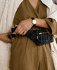 crossbody belt bag with grid-stitched pattern handcrafted in India by Anchal artisans