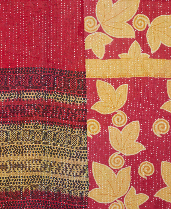 Red and beige artisan made quilt throw featuring a contrasting floral and abstract print 