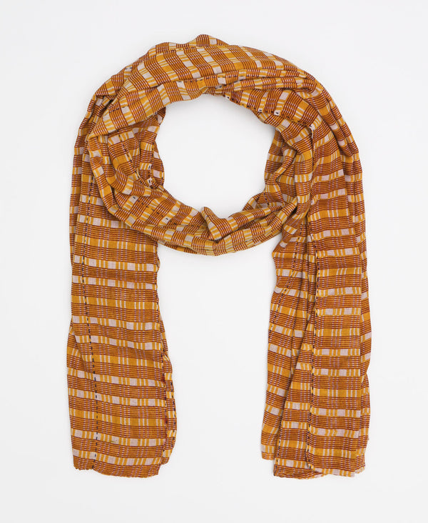 Light orange striped cotton scarf that was made by female artisans earning a fair wage 