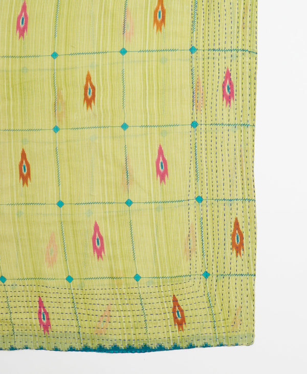 light green square scarf with blue grid, pink and orange traditional patterning and dark blue kantha stitching
