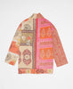 Orange, pink, and beige floral print artisan-made jacket created with upcycled vintage saris 