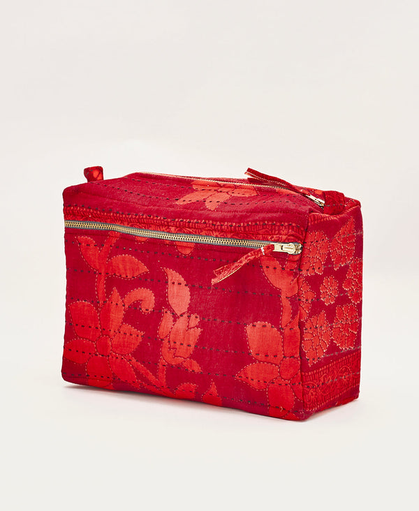 Bold red floral cotton toiletry bag featuring navy traditional cotton hand stitching 