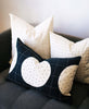 eco-friendly throw pillows styled together on a couch