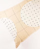 lumbar pillow with small french knot detailing in the colors ivory and bone