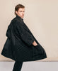 Male model wearing black modern jacket made from organic cotton from Fair Trade artisans 