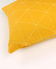 small mustard yellow decorative pillow with modern embroidery stitching