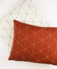 organic cotton throw pillows with hand-embroidered geometric stitching