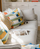 ivory couch with modern cotton quilts and throw pillows by Anchal Project