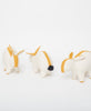 Three organic cotton stuffed bunny toys detailed in ivory and mustard