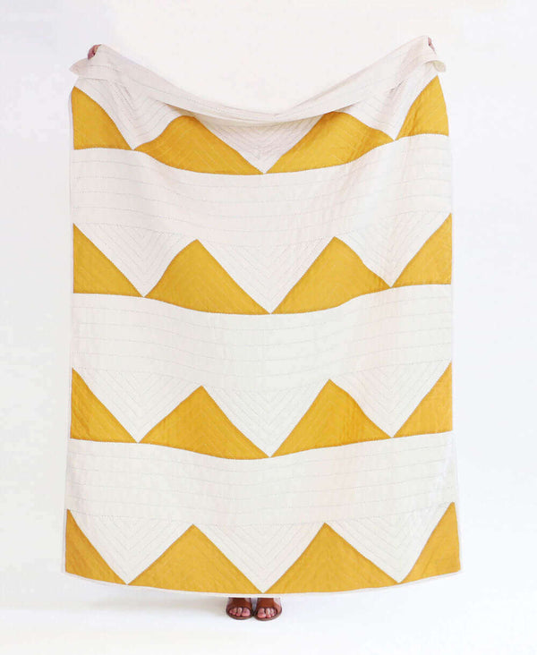mustard yellow triangle geometric quilt throw