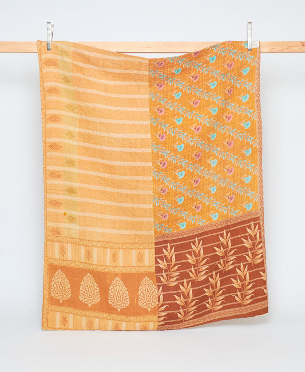 handmade twin sized kantha quilt in mustard yellow and orange hues