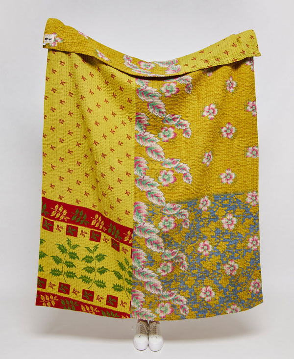 One of a kind yellow quilt throw featuring a floral pattern 
