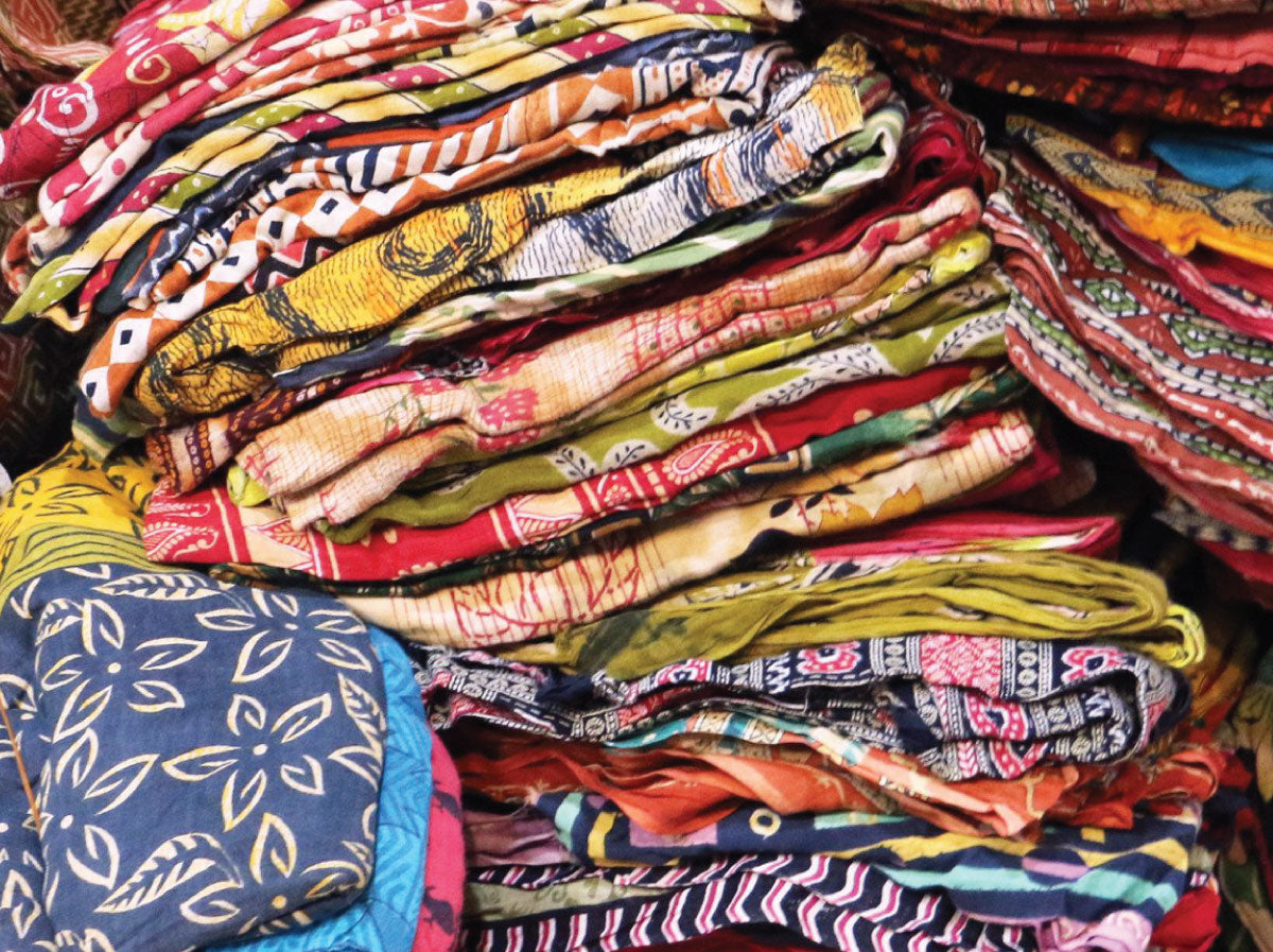 Vintage fabrics piled on top of one another, each piece made by hand