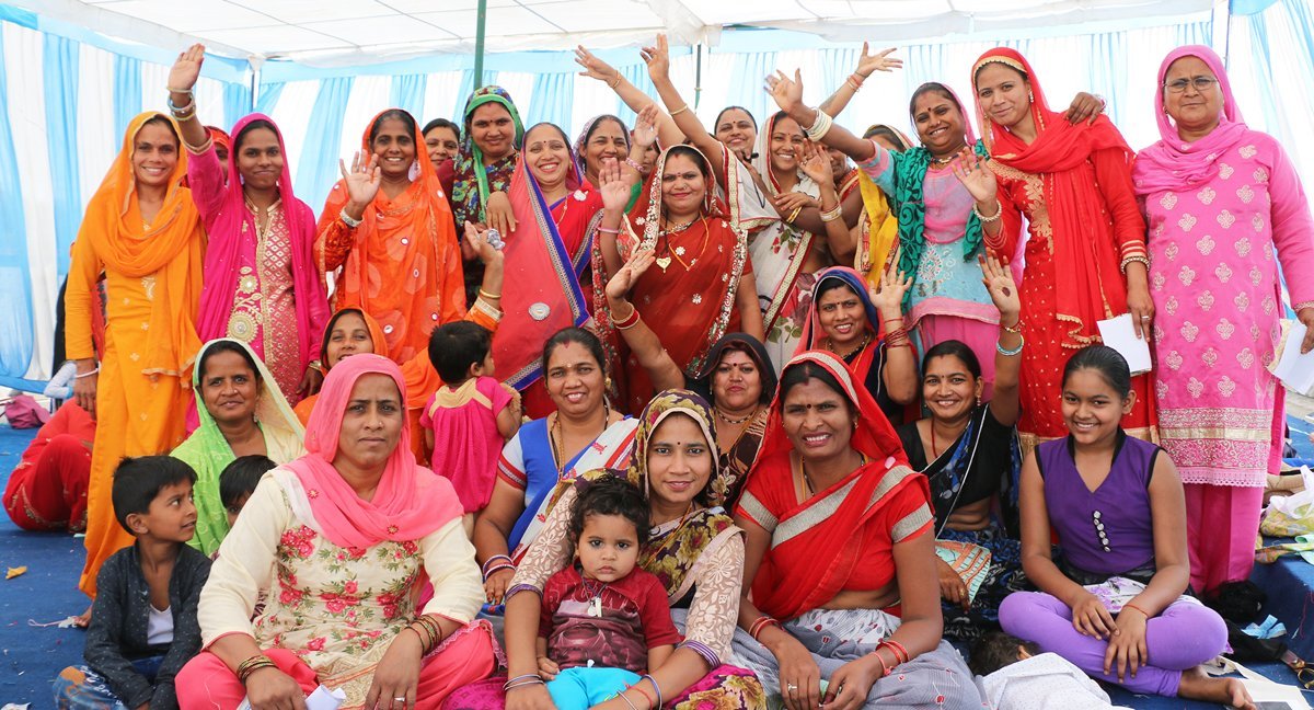 Anchal artisans dressed in saris gathered together to celebrate success and impact for Anchal in 2018